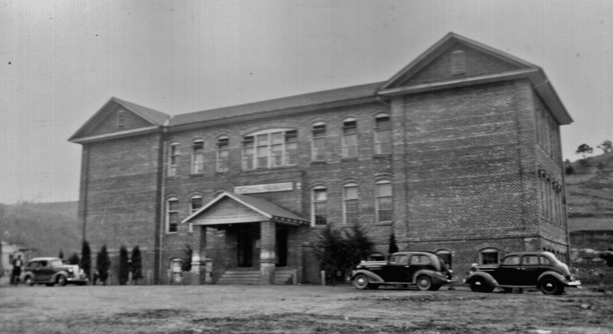 In 1959 , the 30th anniversary of the first graduating class, the old Tipton Hill High School was torn down to make room for the new lunchroom and gym. This building, which was dated May 18, 1921, was funded by the Methodist church and a bible was placed within its walls. This bible was found in 1959 when the building was torn down. Enough funds could not be raised to complete the building so the Mitchell County Board of Education purchased the property on August 26, 1924. By 1927, three years of instruction could be obtained at Tipton Hill High School. Tipton Hill began as a four year High school in 1928. Mr. Yelton was the principal and Mrs. Yelton and Mr. L. R. Vann were the faculty. Seven students graduated that year. In 1930 the High School was accredited by the State Department.