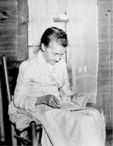 Granny Biddix and her Bible.  Sometimes a picture is worth a thousand words. We don’t know her first name, but her face tells the stories of a long life in the mountains of Mitchell County. Noted Mitchell County photographer Jim Jones took this picture, probably in the 1930’s.  The information on the back simply reads: Granny Biddix and her Bible.