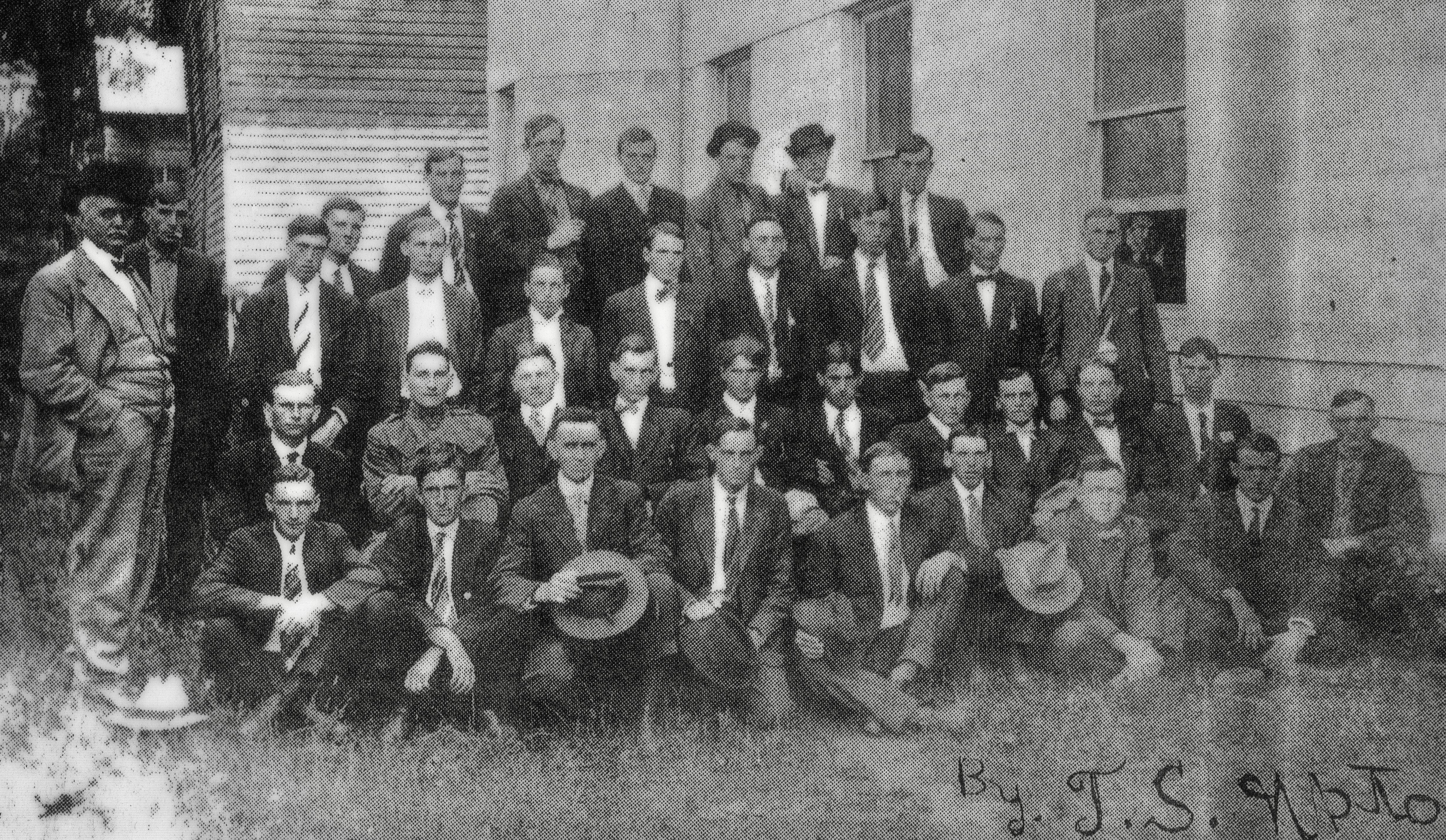 In April 1917, one hundred years ago this month, the United States declared war on Germany. Mitchell Countians joined United States forces as they hoped to fight in a “war to end all wars.” Several groups of enlistees would depart at different times. Pictured above, beside the historic courthouse in Bakersville, is the second group of men to leave for service in World War 1. Not all of the men are identified. A partial list includes: John H. McKinney, Charlie Ramsey, Tane Greene, Talmadge Johnson, Carl Loven, Claude Johnson, Glenn Lawrence, Jeff McKinney, Charlie Winters, Willard Buchanan, Avery Carpenter, George Johnson, Bascom Parsons, Stokes McKinney, Homer McKinney, Lonzo Hall, Charlie Woody (of Hanging Rock), a Mr. Pitman (of Altapass), and a Mr. Thomas. Standing at left is Dr. Smith, the medical examiner. Leaning from the window of the courthouse is Mr. D.W. Greene, Superintendent of Mitchell County Schools. Five Mitchell County men perished in the war. They were Fred N. Cox, Wess R. Ellis, Pvt. Charles E Howell, Homer McKinney, and William F. Ramsey.