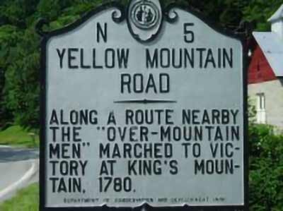 Photo of the historical marker for the Yellow Mountain Road, with the inscription Along a route nearby, the "Over-Mountain Men" marched to victory at King's Mountain, 1780.