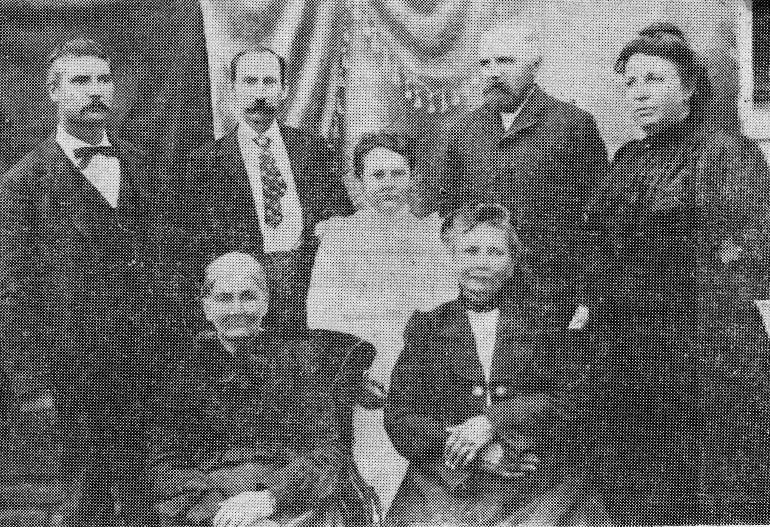 In this photo, sons of James Bailey are shown standing: William Wesley Bailey, Pink Bailey, and John Bailey, as well as John’s wife Mary English Bailey and daughter Cora Lee Bailey. Seated are Mary “Polly” Cox Bailey, widow of James Bailey, as well as Amanda Bailey, daughter of James and Polly; their son Burgess Bailey is not pictured.